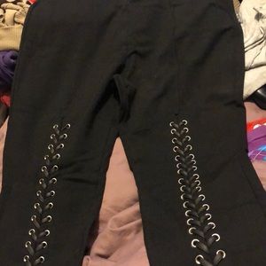 Laced black pants fashion to figure